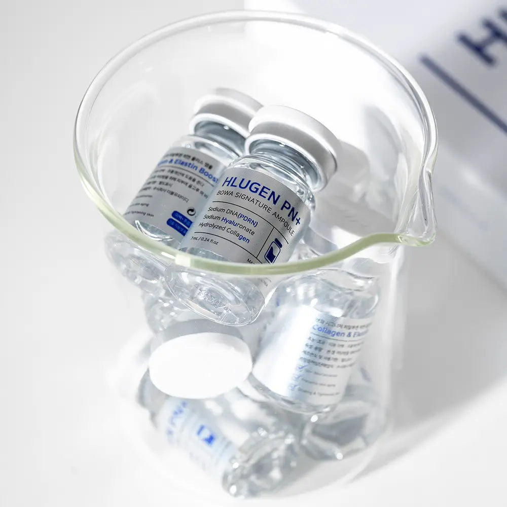 Vials and a container with medical equipment on a white background